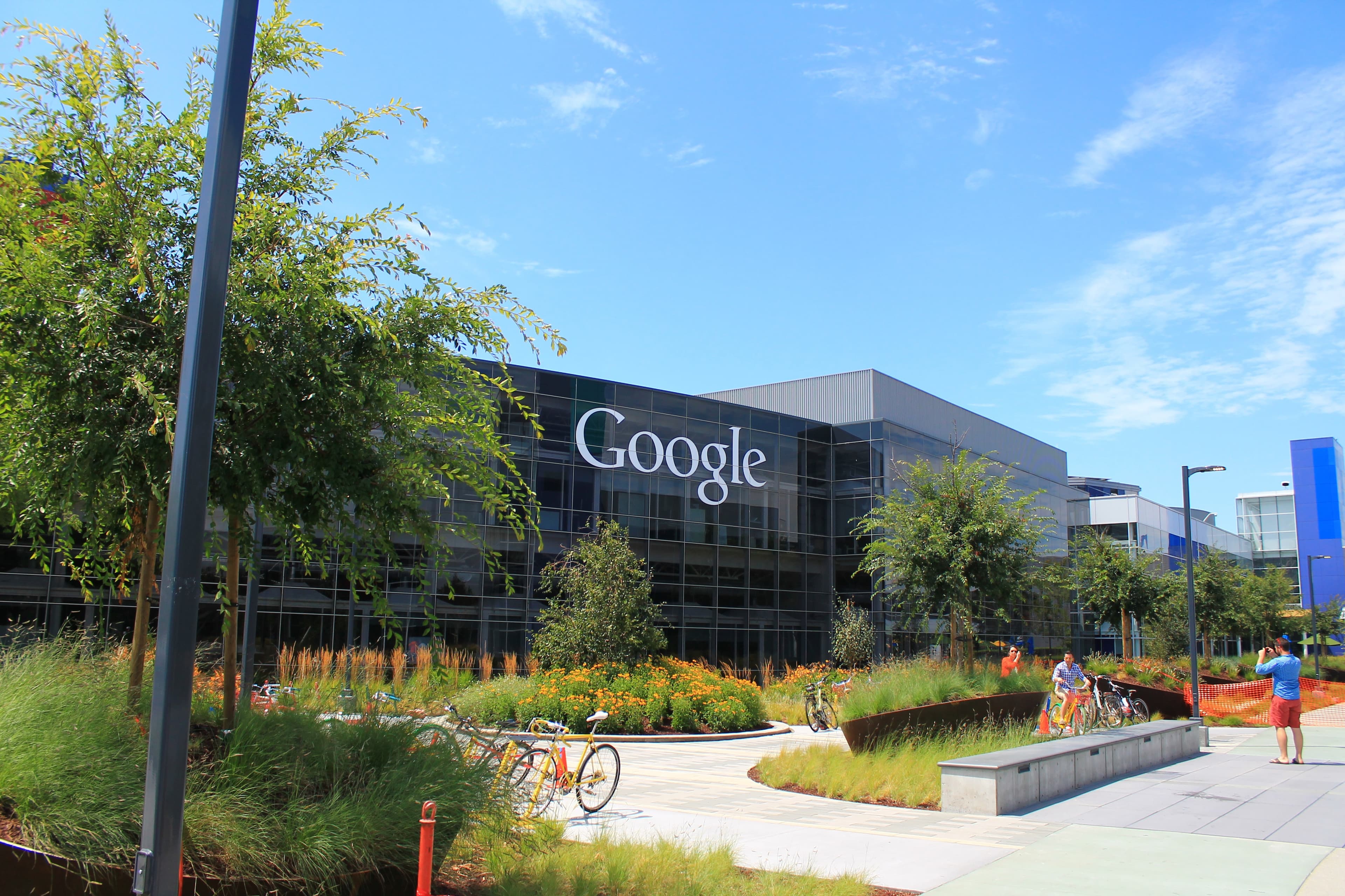 Rows of networked server equipment in a data center, representing the AI infrastructure buildout now driving Alphabet's valuation.