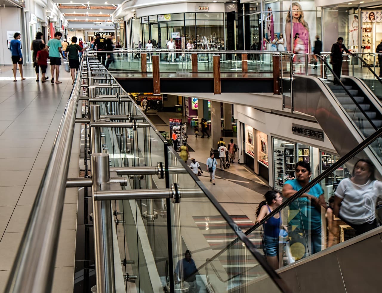 Interior of a retail shopping center with storefronts and open walkways, representing the grocery-anchored and mixed-use retail properties Federal Realty Investment Trust owns and operates.