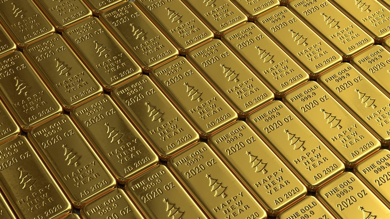 Stacked gold bars, the classic store-of-value asset investors are buying as a hedge against dollar debasement